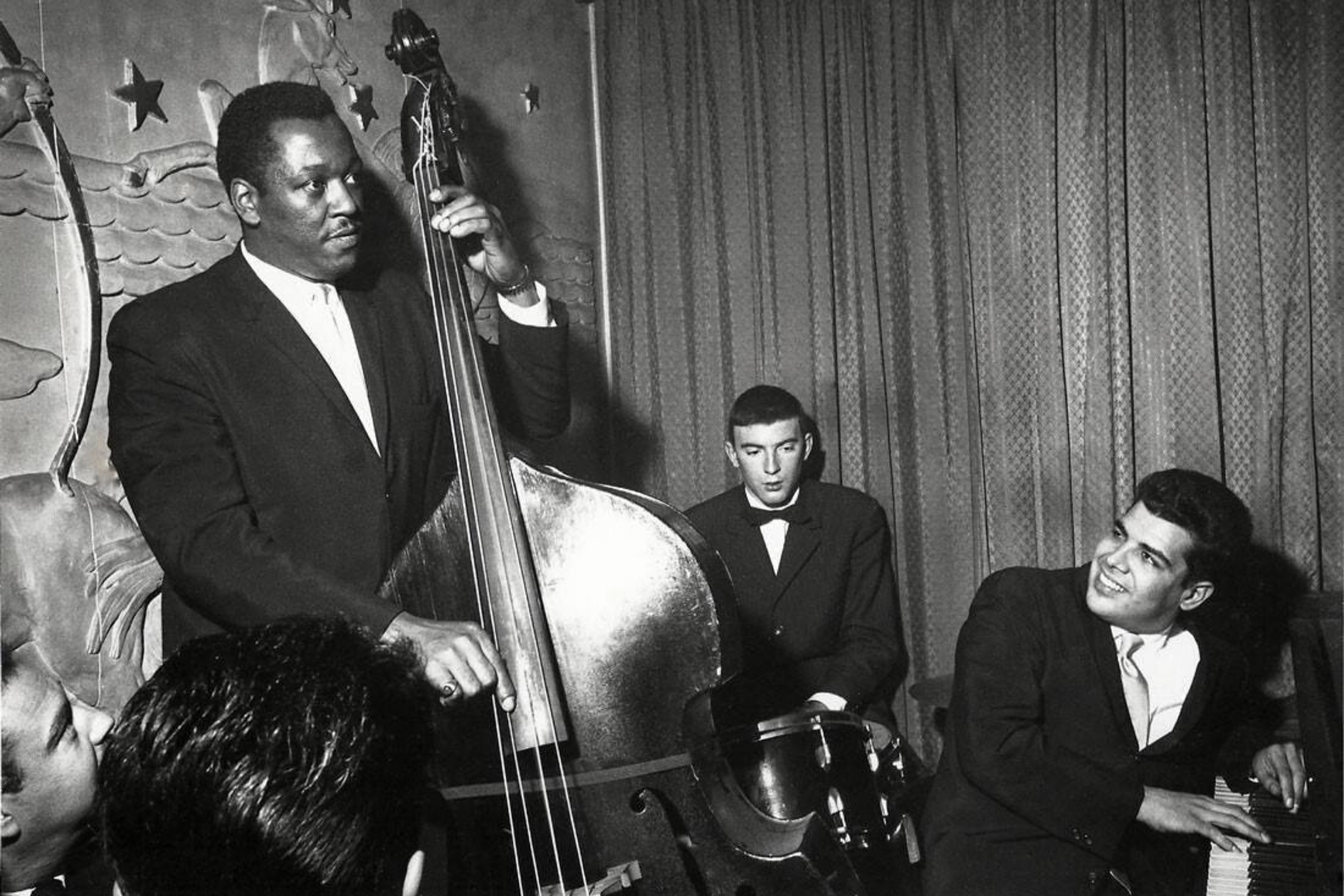 Bassist Leroy Vinnegar plays his bass for a crowd in an Indiana jazz club.