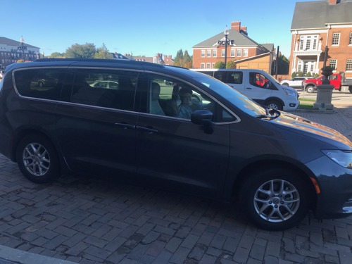 Chelsea in a grey minivan on her way to Washington D.C.